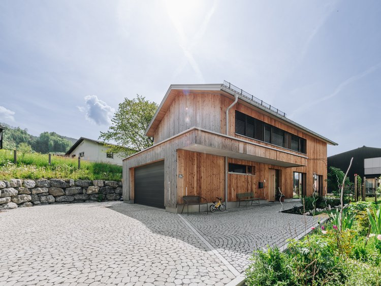 Paved forecourt of a detached house in the countryside
